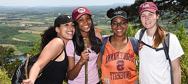 A group of students pose for a photo atop Mt. Mahanoy after the Senior Hike